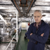 Boiler room fit: Fireman Colin Dykes takes charge of the ship's boiler room. Photograph: Martin Shields