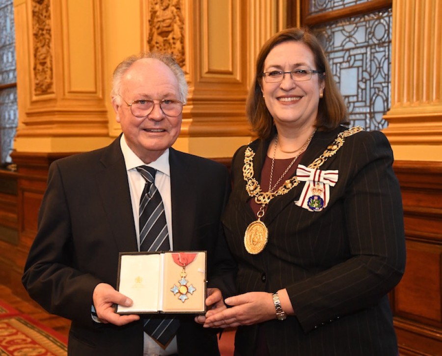  Honour: Bill Mann receives his CBE from Lord Provost Eva Bolander